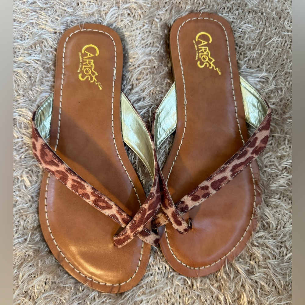 Carlos Santana leopard print sandals.